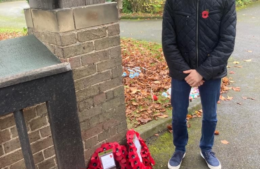 Cllr Tom Hughes lays a wreath